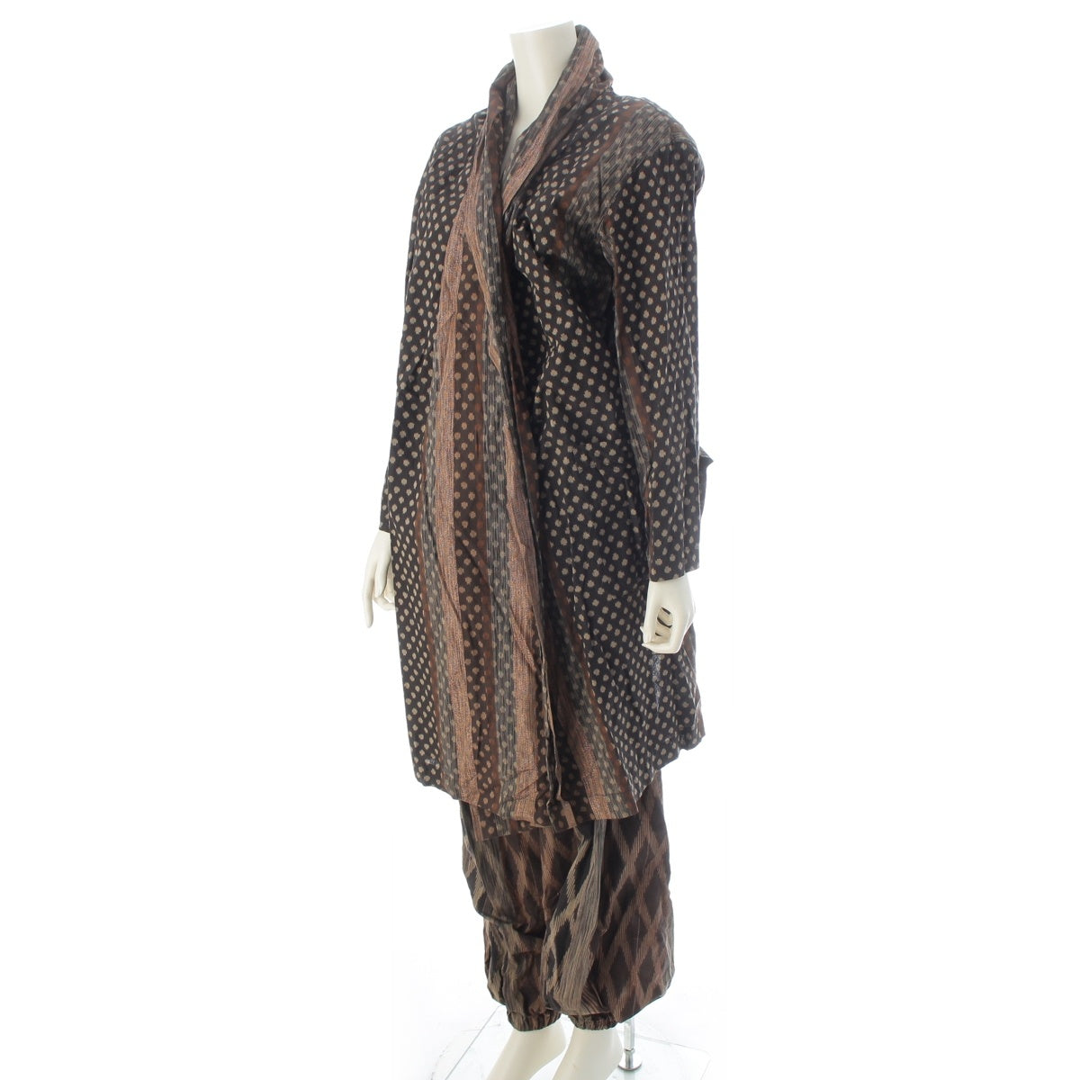 ISSEY MIYAKE All-over pattern, irregularly shaped ikat fabric, shoulder pads, draped skort, docking. Pants setup Brown 9